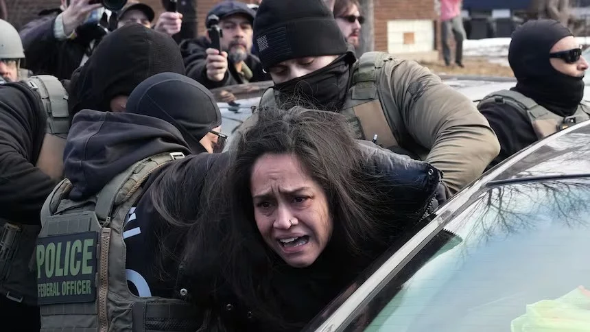 Image Credit : Adam Gray/The Associated Press  Aliya Rahman is arrested by ICE agents in Minneapolis on Tuesday. The U.S. citizen says she was headed to a dr appointment when agents force her from her car. 