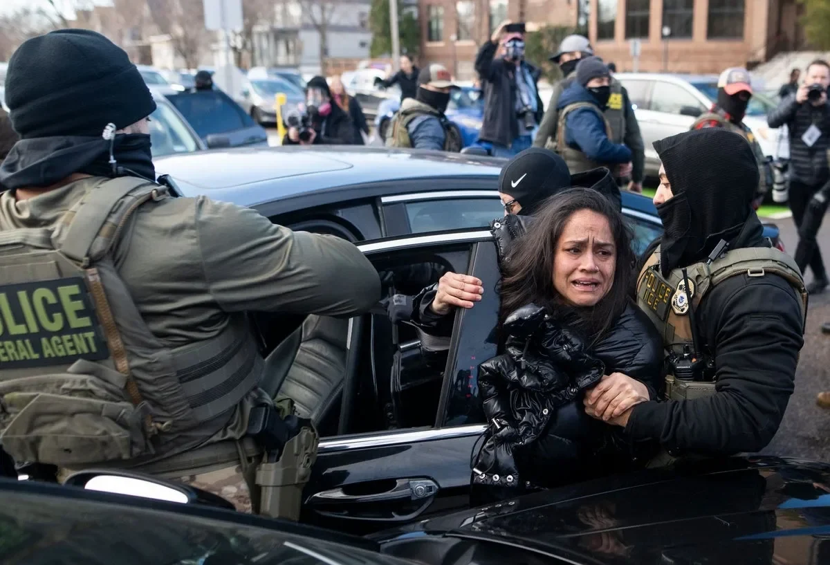 Image Credit : Getty Aliya Rahman being dragged from her car by federal agents