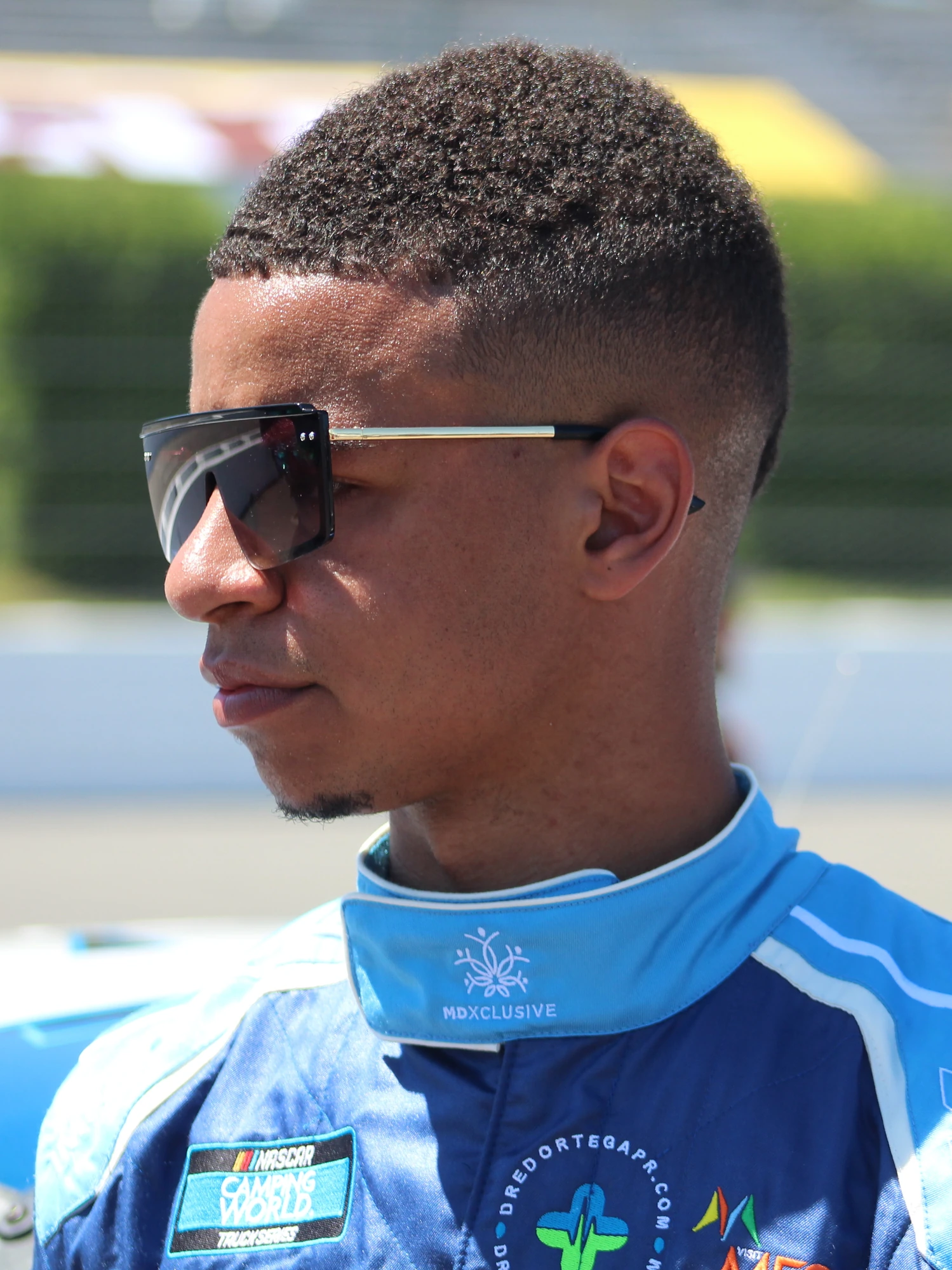 Armani Williams wearing his racing suit and sunglasses