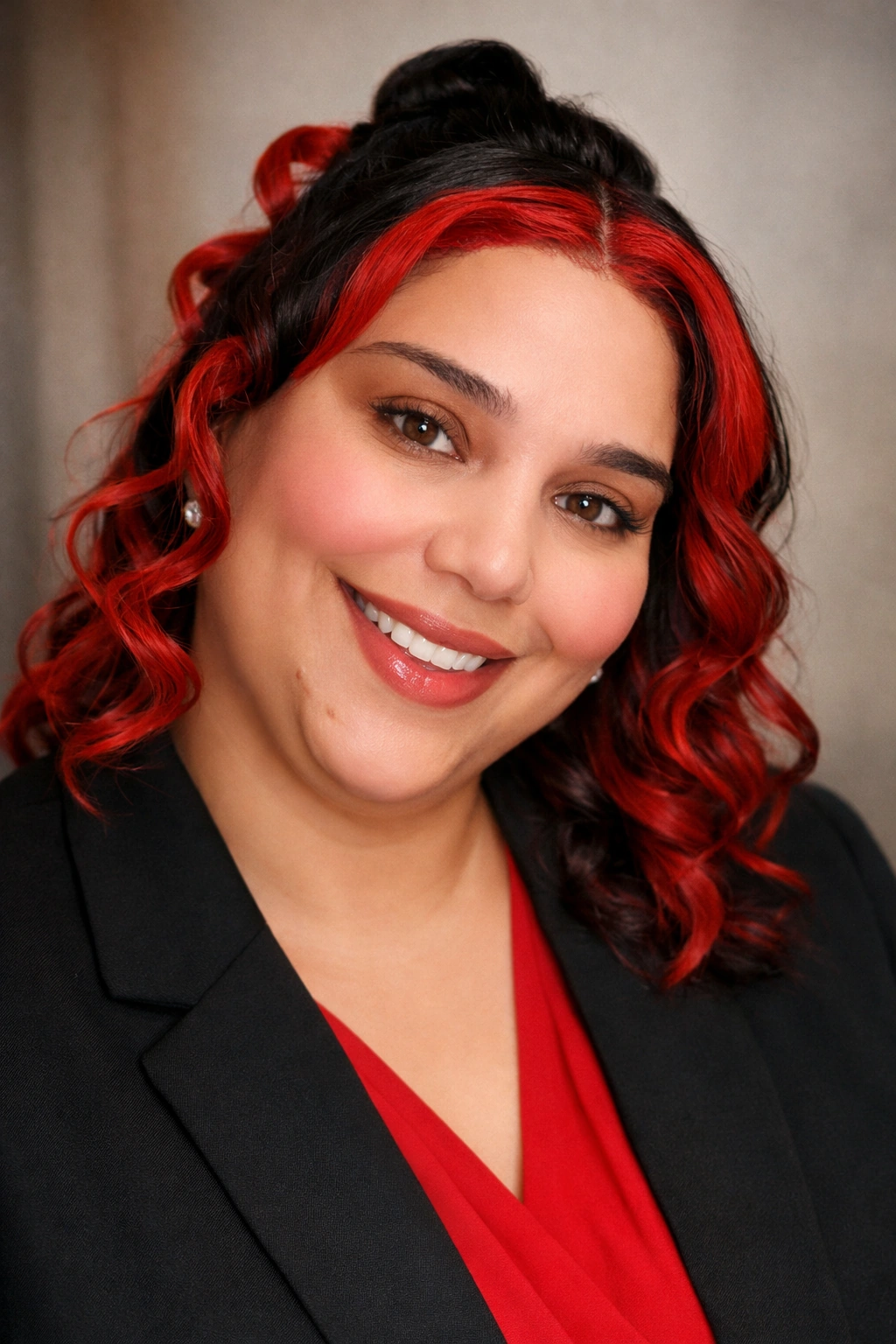 Ashley Marion, founder of Leyla Strong Foundation, wearing a black jacket and red top.